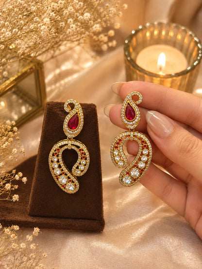 Ruby earrings, Kundan earrings, statement earrings, gold-plated earrings, festive jewellery, wedding earrings, ethnic earrings for women, bridal jewellery, designer drop earrings, party wear earrings, traditional Indian jewellery.